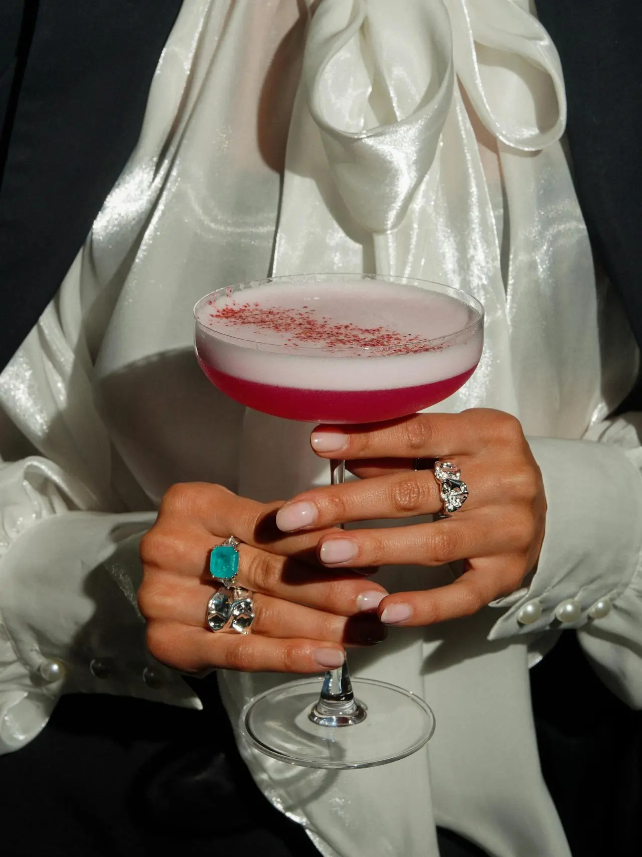 Woman holding a cocktail showing nails
